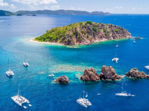 sunsail-hero A Sunsail charter vessel near an island.